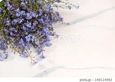 Beautiful spring forget-me-nots on a sunny background, abstract floral arrangement, still life with spring flowers of different varieties, floral greeting card, screen banner, design template Beautiful spring forget-me-nots on a sunny background, abstract floral arrangement, still life with spring flowers of different varieties, floral greeting card, screen banner, design template 140114992