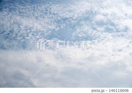 A wide natural sky scene with drifting clouds over the horizon captures a peaceful outdoor atmosphere with soft daylight and fresh summer air. A wide natural sky scene with drifting clouds over the horizon captures a peaceful outdoor atmosphere with soft daylight and fresh summer air. 140118606