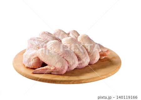 fresh raw chicken wings on a cutting board isolated on a white background, top view. 140119166
