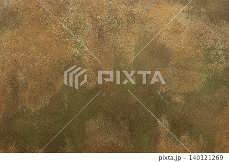 A textured surface with worn coloring appears in the frame. Ochre, green, tan, and brown shades mix to create an abstract design with a rugged feel A textured surface with worn coloring appears in the frame. Ochre, green, tan, and brown shades mix to create an abstract design with a rugged feel 140121269