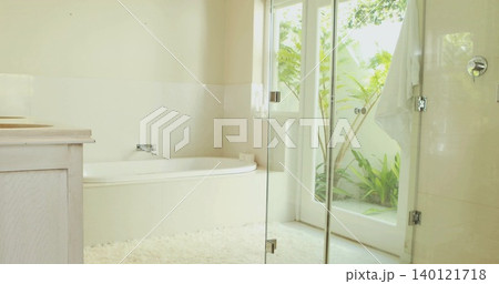 Featuring built-in alcove bathtub gleaming with chrome faucet in home bathroom, showing plush rug Featuring built-in alcove bathtub gleaming with chrome faucet in home bathroom, showing plush rug 140121718
