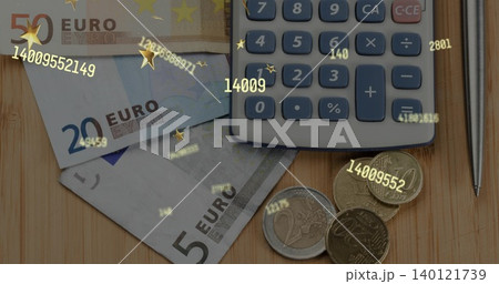 Showing 50, 20, 5 euro bills, coins and grey calculator on wooden tabletop showing numeric overlay Showing 50, 20, 5 euro bills, coins and grey calculator on wooden tabletop showing numeric overlay 140121739