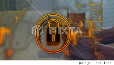 Showing orange lock icon overlaying blurred desk with laptop, hands, light long sleeve, neon traces 140121787