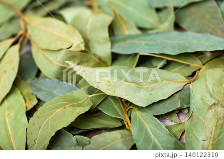 Pile of dried bay leaves lie on table Pile of dried bay leaves lie on table 140122310