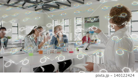 Showing instructor in lab holding vial and dish at right bench, wearing lab coat, copy space Showing instructor in lab holding vial and dish at right bench, wearing lab coat, copy space 140122424