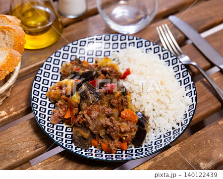 Stewed eggplants with minced meat and white rice closeup Stewed eggplants with minced meat and white rice closeup 140122439