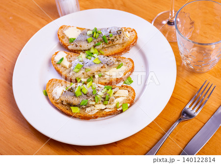 Closeup of delicious sandwich with herring, onions, and butter 140122814