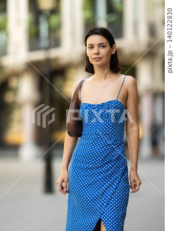 Young woman posing on city street Young woman posing on city street 140122830