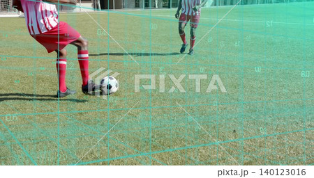 Controlling player in red-striped kit moving on soccer field with ball and grid overlay, copy space 140123016