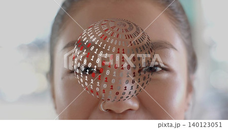 Framing adult Chinese woman facing camera indoors, showing silver hoop nose ring and binary sphere Framing adult Chinese woman facing camera indoors, showing silver hoop nose ring and binary sphere 140123051
