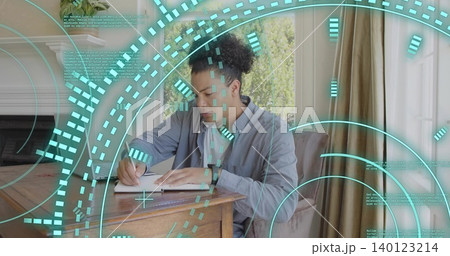 Sitting man wearing shirt, using pen in notebook at wooden desk near window, showing teal HUD Sitting man wearing shirt, using pen in notebook at wooden desk near window, showing teal HUD 140123214
