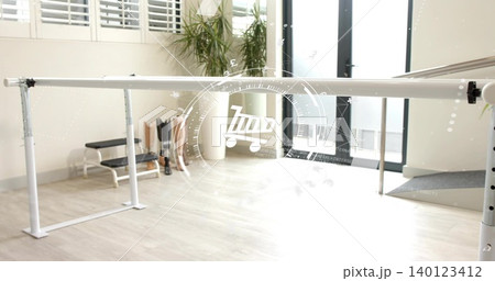 Spanning white adjustable parallel gait bars in therapy room, showing prosthetic limbs, HUD cart 140123412