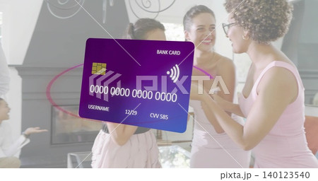 Displaying large purple bank card overlay covering center of residence, with guests wearing pastels 140123540