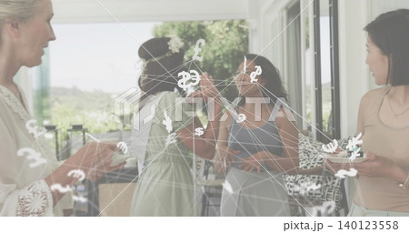 Toasting five women near sliding doors wearing green dress holding plates showing currency overlay Toasting five women near sliding doors wearing green dress holding plates showing currency overlay 140123558