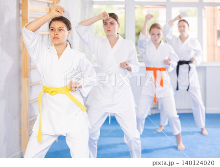 Teenage girls in kimono doing kata training Teenage girls in kimono doing kata training 140124020