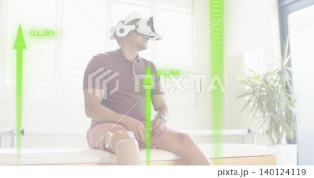 Sitting man wearing maroon polo using VR headset in rehab room, with prosthetic leg and HUD Sitting man wearing maroon polo using VR headset in rehab room, with prosthetic leg and HUD 140124119
