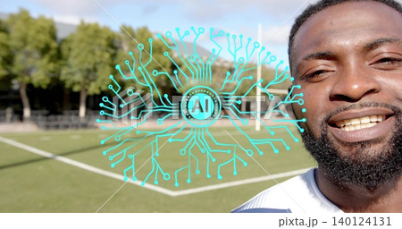 Smiling player in white jersey standing at turf pitch, teal AI graphic, copy space Smiling player in white jersey standing at turf pitch, teal AI graphic, copy space 140124131