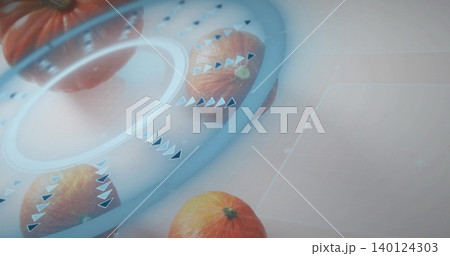 Displaying small orange pumpkins resting on studio tabletop, with cyan-blue ring and arrow markers Displaying small orange pumpkins resting on studio tabletop, with cyan-blue ring and arrow markers 140124303