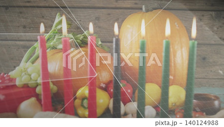 Showing center harvest still life on wooden table with seven taper candles, pumpkins, bowl, overlay 140124988