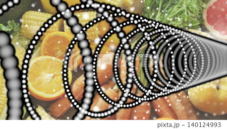 Featuring dotted spiral dominating tabletop, overlaying halved orange, carrots, corn, greens 140124993