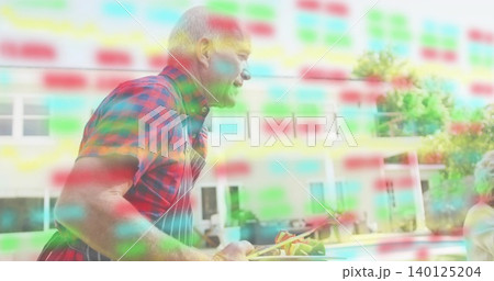 Grilling man in plaid shirt, striped apron holding tongs and skewers at patio pool, RGB overlays Grilling man in plaid shirt, striped apron holding tongs and skewers at patio pool, RGB overlays 140125204