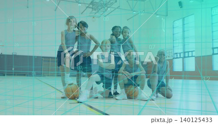 Posing seven kids wearing matching sleeveless jerseys and shorts in school gym, two basketballs Posing seven kids wearing matching sleeveless jerseys and shorts in school gym, two basketballs 140125433