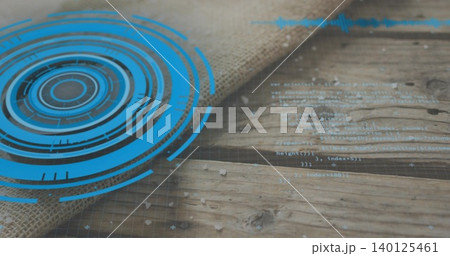 Showing blue HUD graphic on left of wooden plank table, overlaying burlap, code, flakes, copy space 140125461