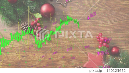 Showing market chart overlay across wooden table, with fir sprigs, pine cones, red baubles, tinsel 140125652
