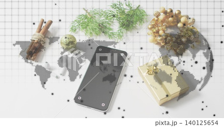 Showing black phone with screws on grid paper, with gold gift, cinnamon, pine, halftone map Showing black phone with screws on grid paper, with gold gift, cinnamon, pine, halftone map 140125654