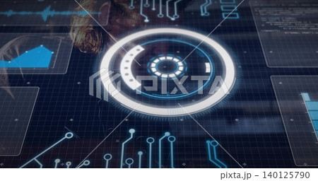 Projecting circular HUD over glass table in tech lab, showing data panels, male wearing dark jacket 140125790