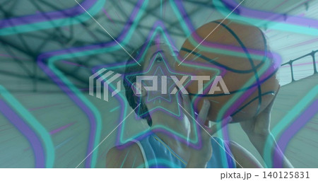 Holding woman aiming basketball at gym, sleeveless jersey, neon overlay, roof trusses and skylights Holding woman aiming basketball at gym, sleeveless jersey, neon overlay, roof trusses and skylights 140125831