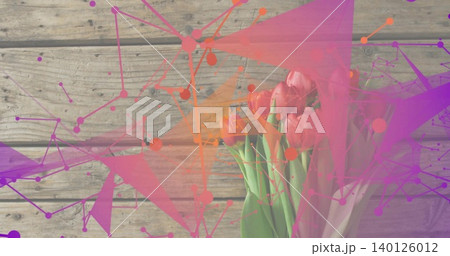 Showing pink tulip bouquet, green stems in pale wrap on wooden plank, colorful overlays, copy space 140126012