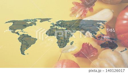 Displaying stylized map overlay on yellow backdrop, showing data markers, autumn leaves, pumpkins 140126017