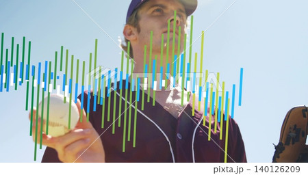 Extending player showing baseball to camera under blue sky, glove, cap, maroon jersey, color bars 140126209