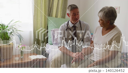 Sitting doctor in shirt and tie consulting senior woman on bed, with stethoscope, waveform overlay Sitting doctor in shirt and tie consulting senior woman on bed, with stethoscope, waveform overlay 140126452