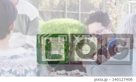 Four friends are dining at wooden patio table with salad, wine in flat design hospitality scene 140127406
