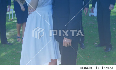 Bridal couple is standing outdoors in flat design, showing wedding theme with dress and black suit Bridal couple is standing outdoors in flat design, showing wedding theme with dress and black suit 140127528