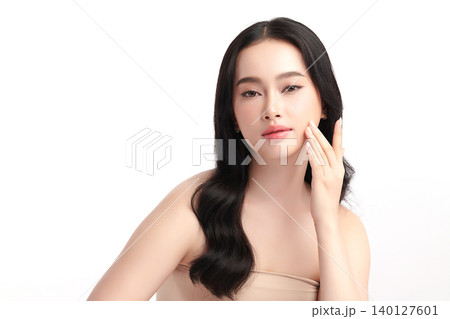 A beautiful young Asian woman with clean, fresh skin against a white background. Skincare, facial treatment, cosmetology, beauty, and spa. An elegant portrait of an Asian woman. A beautiful young Asian woman with clean, fresh skin against a white background. Skincare, facial treatment, cosmetology, beauty, and spa. An elegant portrait of an Asian woman. 140127601