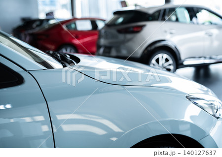 Car parked in luxury showroom. Car dealership office. Car showroom business. New car parked in modern showroom. Auto for sale and rent business. Automobile leasing and insurance. Electric automobile. Car parked in luxury showroom. Car dealership office. Car showroom business. New car parked in modern showroom. Auto for sale and rent business. Automobile leasing and insurance. Electric automobile. 140127637