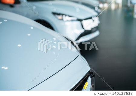 Car parked in luxury showroom. Car dealership office. Car showroom business. New car parked in modern showroom. Auto for sale and rent business. Automobile leasing and insurance. Electric automobile. 140127638