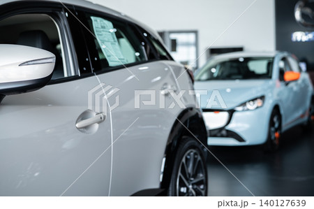 Car parked in luxury showroom. Car dealership office. Car showroom business. New car parked in modern showroom. Auto for sale and rent business. Automobile leasing and insurance. Electric automobile. Car parked in luxury showroom. Car dealership office. Car showroom business. New car parked in modern showroom. Auto for sale and rent business. Automobile leasing and insurance. Electric automobile. 140127639