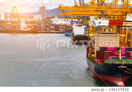 Logistics and transportation of container cargo ship at ship port. Container truck and crane bridge in shipyard. Import export and transport industry. Terminal port for export transport by ship. Logistics and transportation of container cargo ship at ship port. Container truck and crane bridge in shipyard. Import export and transport industry. Terminal port for export transport by ship. 140127830