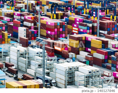 Logistics and transportation of container cargo ship at ship port. Container truck and crane bridge in shipyard. Import export and transport industry. Terminal port for export transport by ship. Logistics and transportation of container cargo ship at ship port. Container truck and crane bridge in shipyard. Import export and transport industry. Terminal port for export transport by ship. 140127846