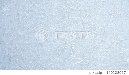 Close-up of white textured concrete building wall with rough surface, ideal for backgrounds or architectural design concepts. Modern and minimalist white wall with a raw, industrial feel. Empty space. 140128027
