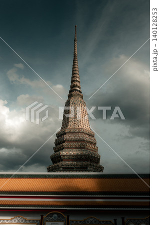 Wat Pho Chedi Rising Above the Temple Roof in Bangkok Wat Pho Chedi Rising Above the Temple Roof in Bangkok 140128253