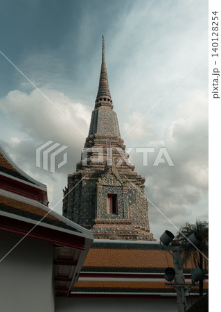 Wat Pho Chedi Rising Above the Temple Roof in Bangkok Wat Pho Chedi Rising Above the Temple Roof in Bangkok 140128254
