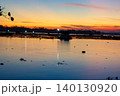 Beautiful Golden Sunset Over a Serene Lake with Water Reflections 140130920