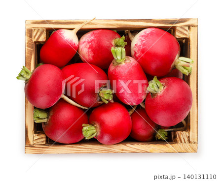 Radishes in a wooden box isolated on a white. Top view 140131110