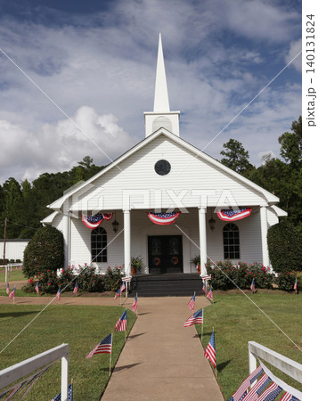 Small White church With Flags in Rural Texas Small White church With Flags in Rural Texas 140131824