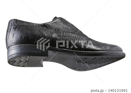 Men black textured leather oxford shoe isolated on white background. Elegant classic dress shoe with ribbed pattern, side bottom view. Men black textured leather oxford shoe isolated on white background. Elegant classic dress shoe with ribbed pattern, side bottom view. 140131991